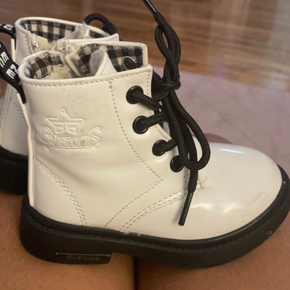 White and black toddler boots